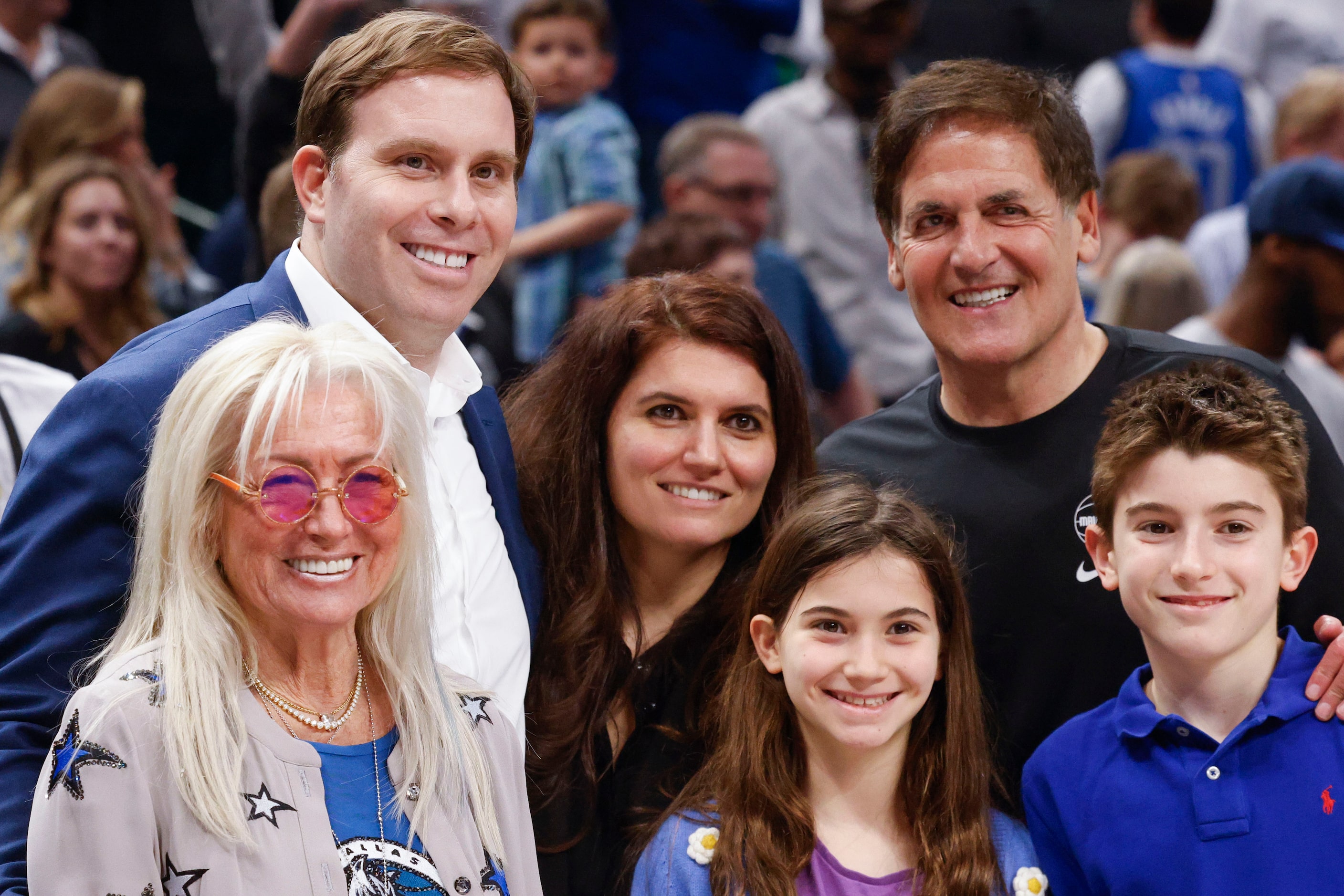 Dallas Mavericks Governor Patrick Dumont (left back), pose a photo with his mother-in-law,...