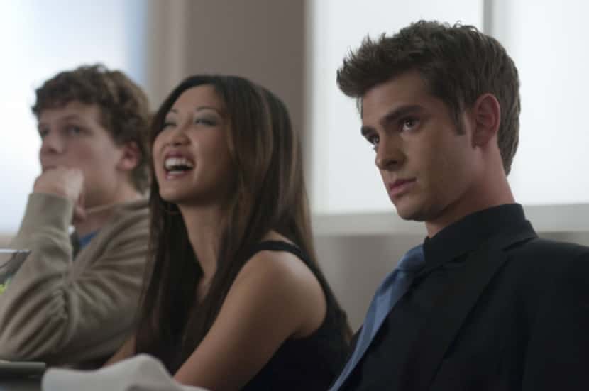 Left to right, Jesse Eisenberg, Brenda Song and Andrew Garfield are shown in a scene from...