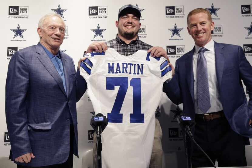 Dallas Cowboys draft pick Zach Martin, center, poses for photos with team owner Jerry Jones...