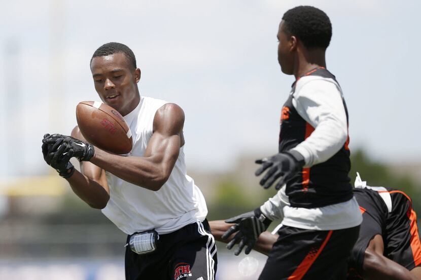 St. Thomas receiver Jhamon Ausbon misses a pass in the first half during the TAPPS 7-on-7...