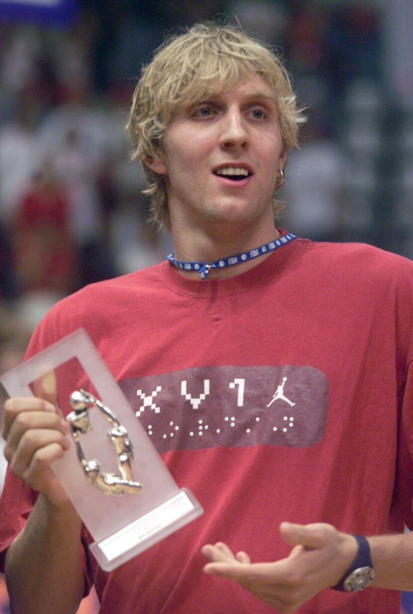 Germany's Dirk Nowitzki of the NBA's Dallas Mavericks display trophy for the best scorer of...