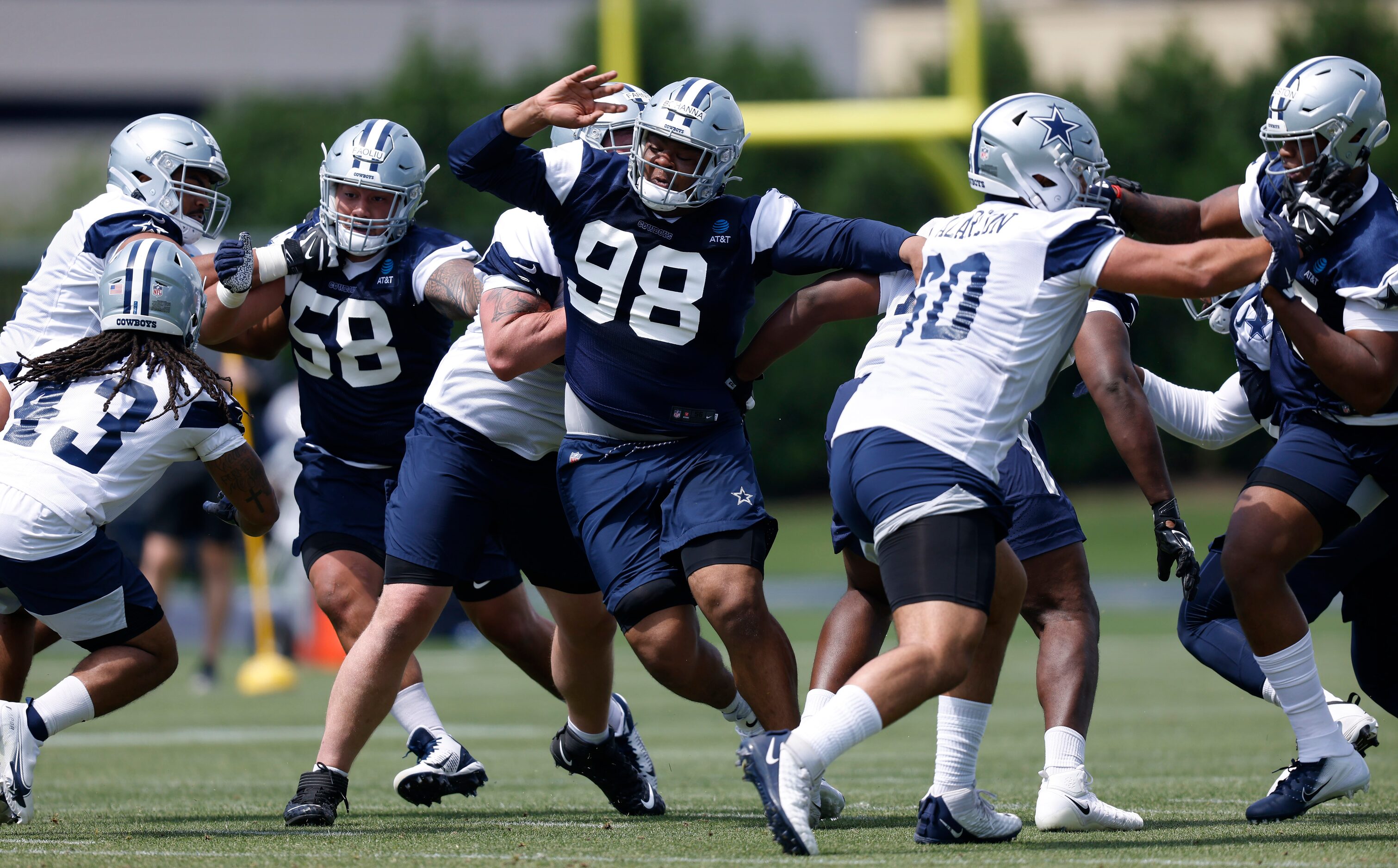 Dallas Cowboys rookie defensive tackle Quinton Bohanna (98) gets through the offensive line...