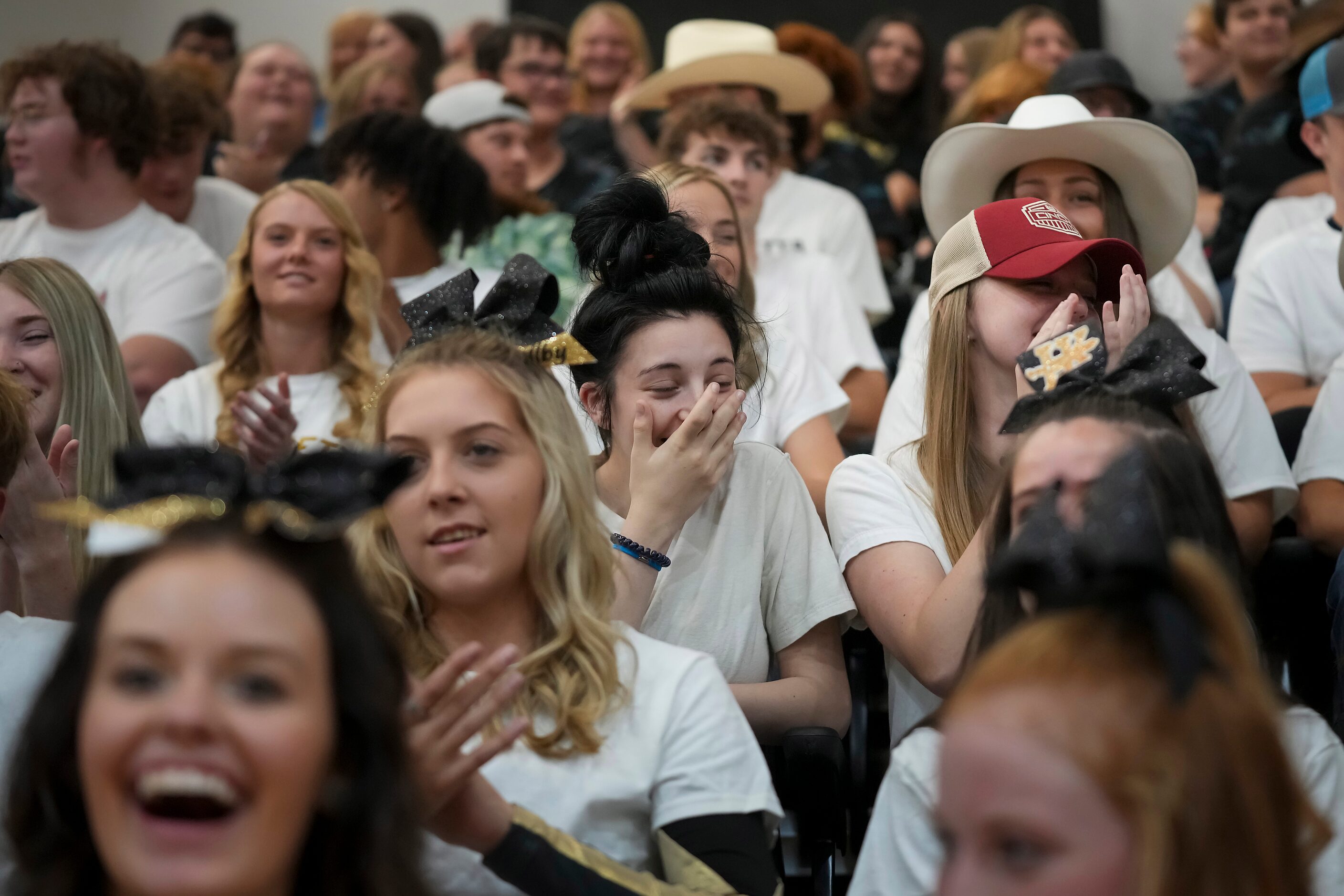 Students react after Troy Aikman announced that Blake Shelton will headline a music festival...