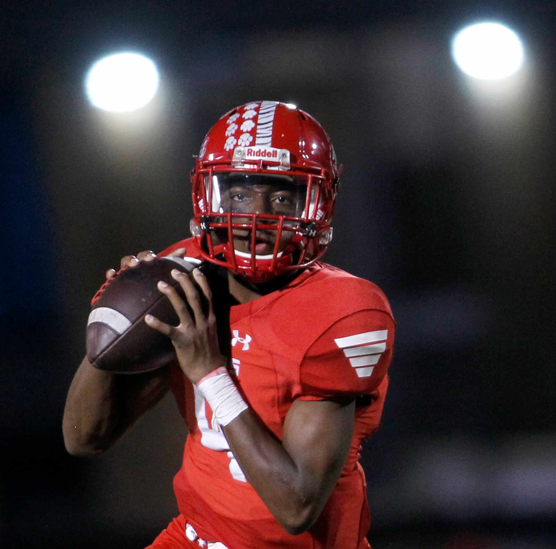 Terrell quarterback Lindon Henderson (4) looks for a receiver during first quarter action...