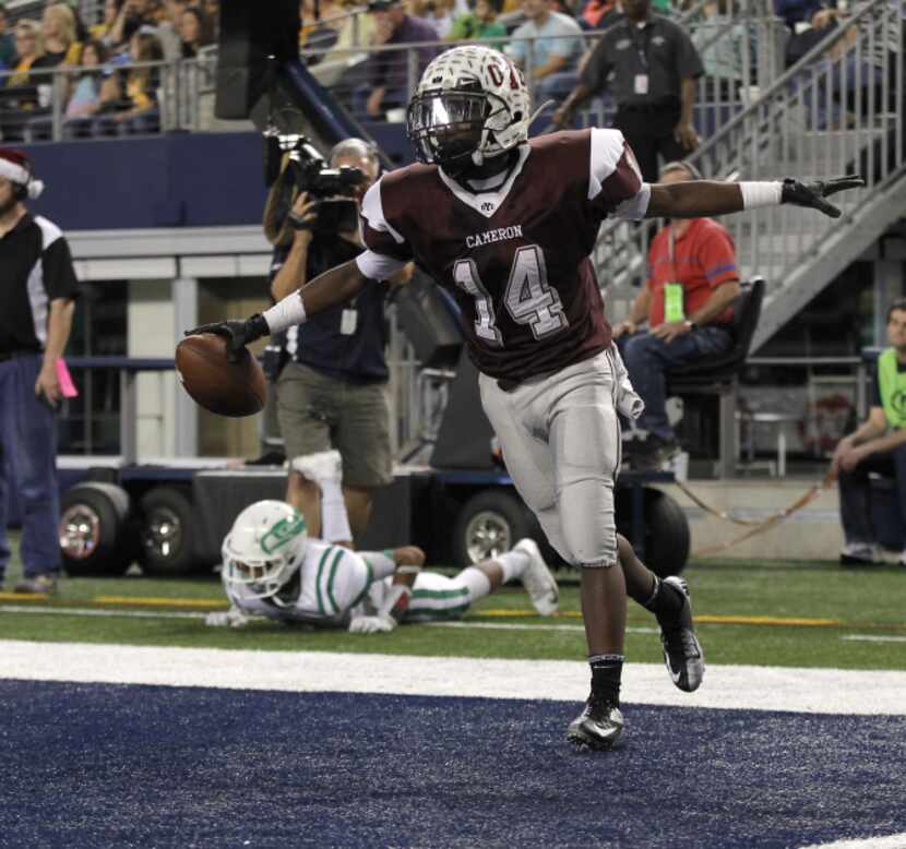 Cameron Yoe's Aaron Sims celebrates after scoring a touchdown against Wall Hawks during the...