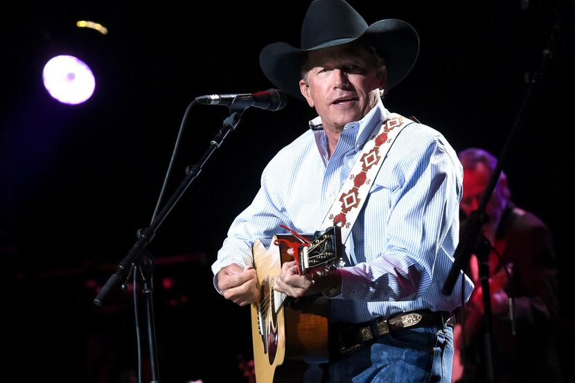 In this handout photo provided by Hand in Hand, George Strait performs onstage during George...
