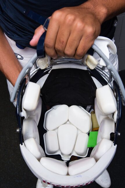 Liberty Christian School football player Andre Washington displays the inside of his helmet,...