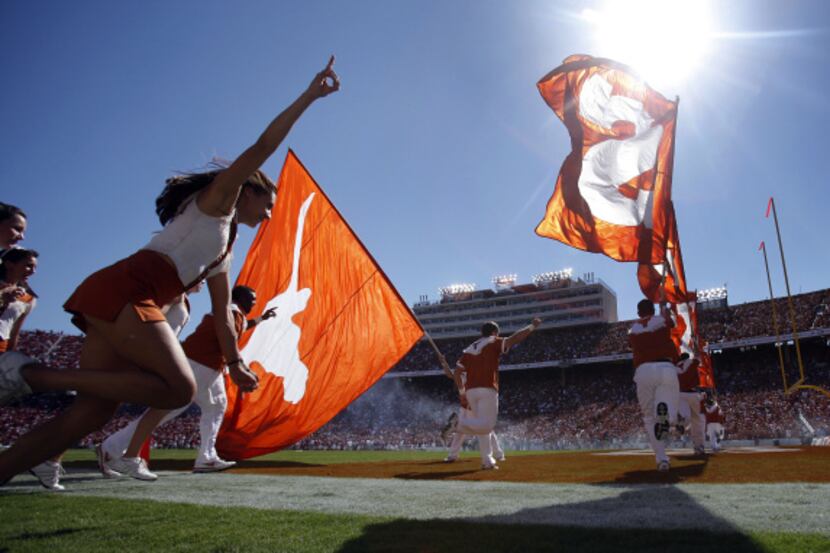 The Texas cheer squad will race onto the field at the Cotton Bowl at Fair Park as the...