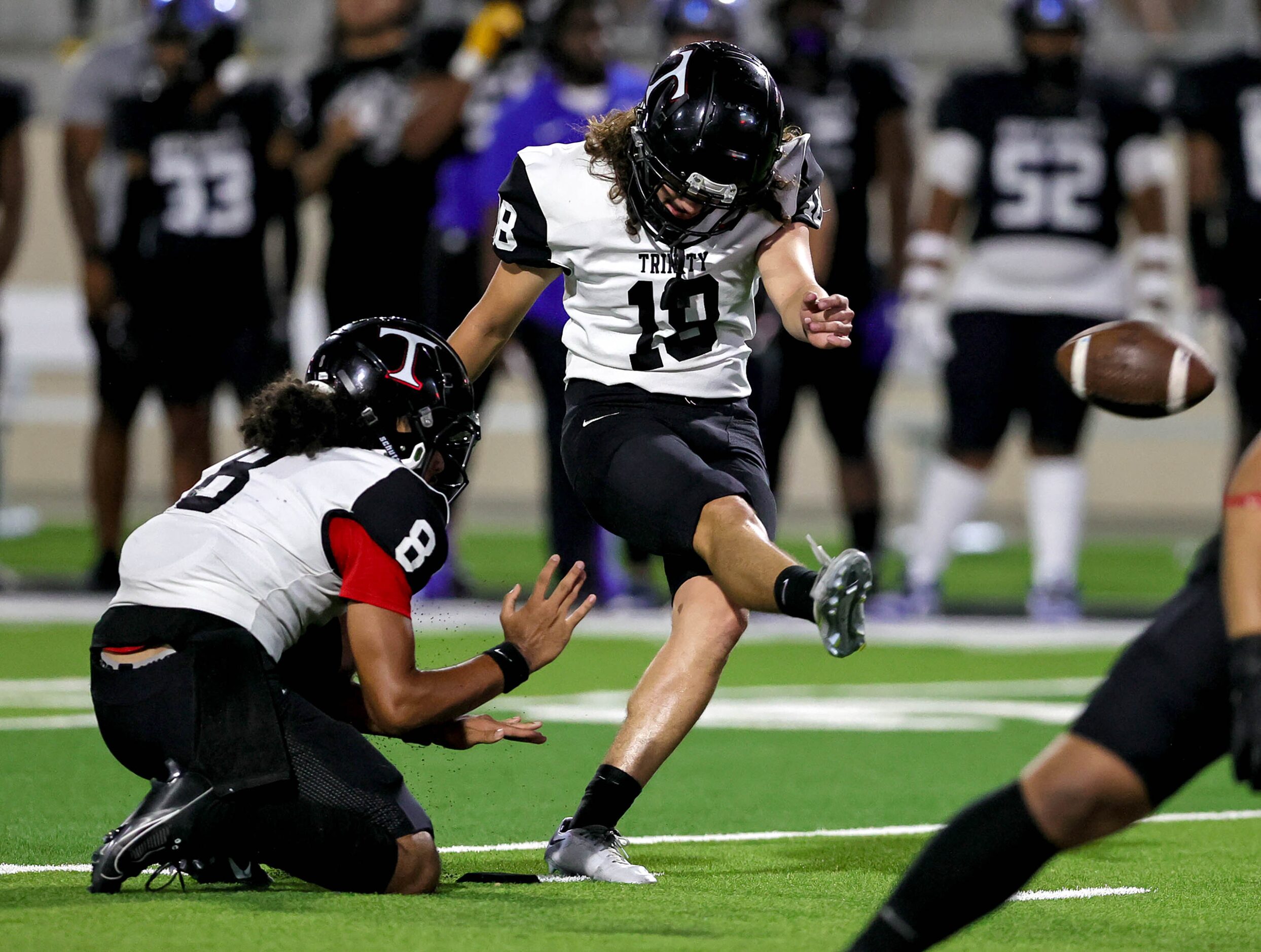 Euless Trinity kicker Andrew Gutierrez (18) attempts a field goal against North Crowley...