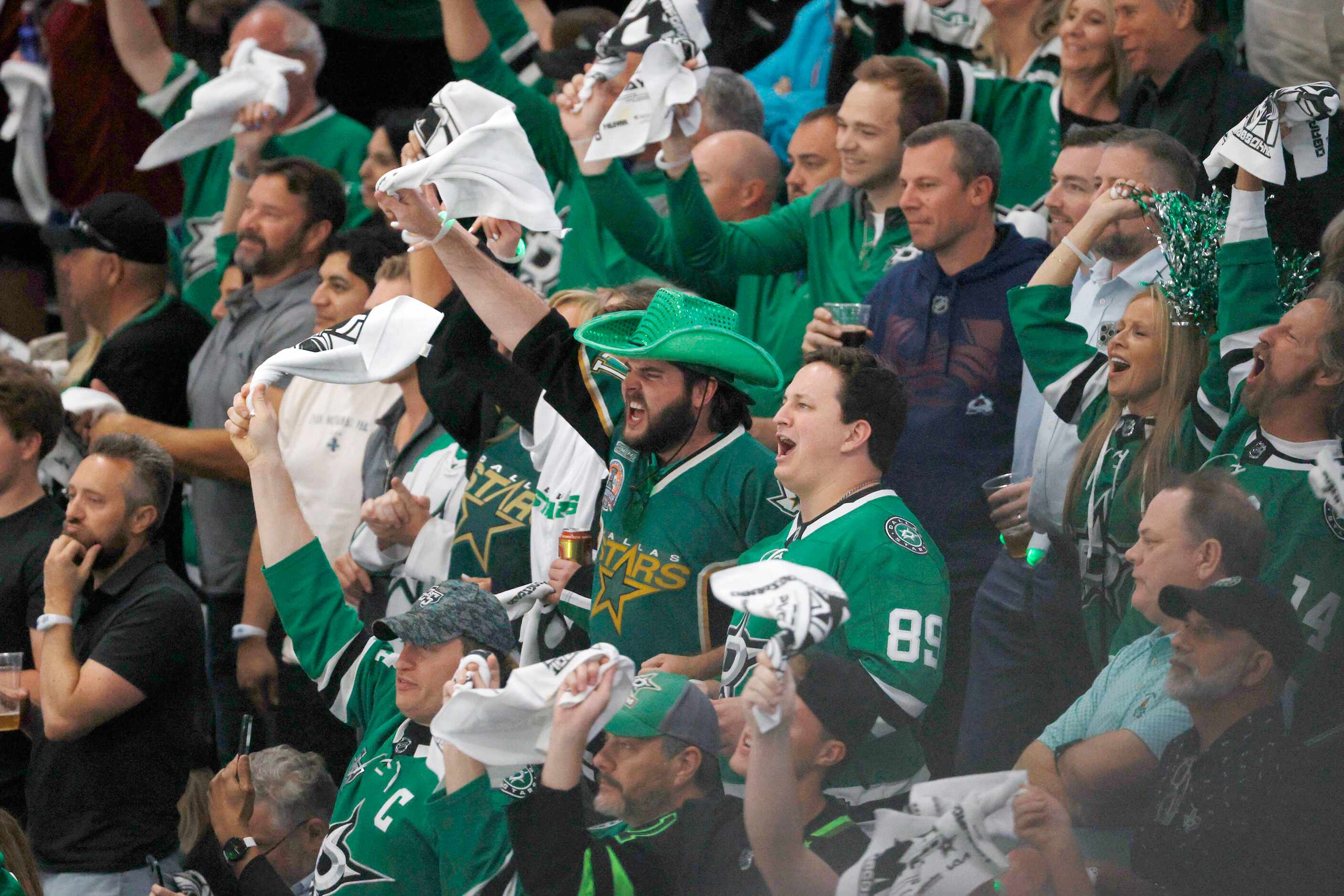 Dallas Stars fans cheer during the third period in Game 5 of an NHL hockey Stanley Cup...