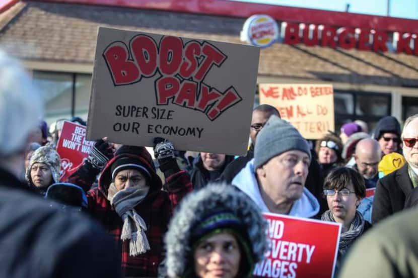 Demonstrators protested low wages for fast-food workers outside a Burger King in Minneapolis...