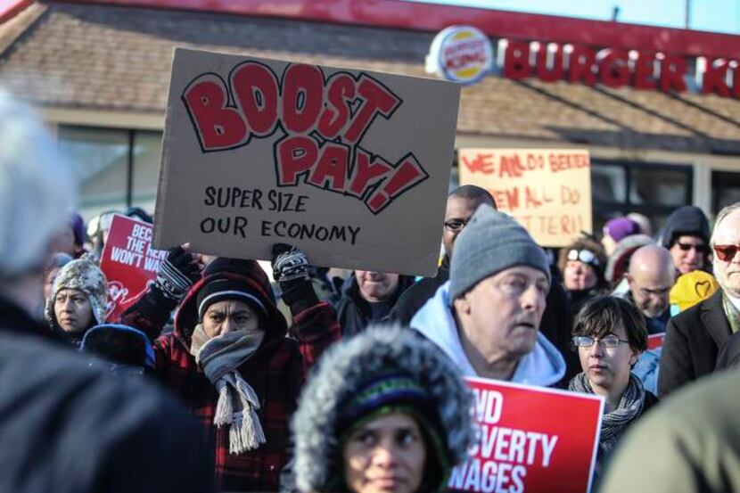 
Demonstrators protested low wages for fast-food workers outside a Burger King in...