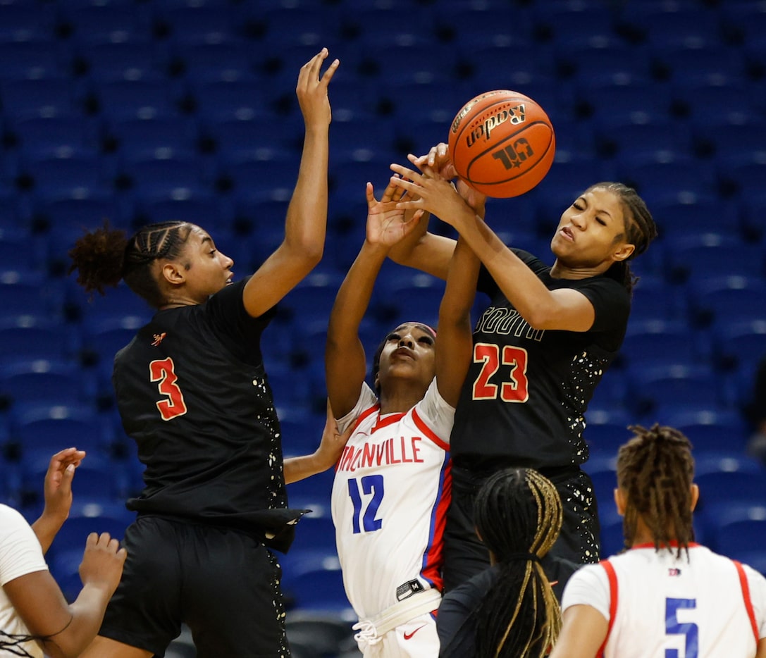 Duncanville's Kaylinn Kemp (12) battles for a rebound with South Grand Prairie's Taylor...