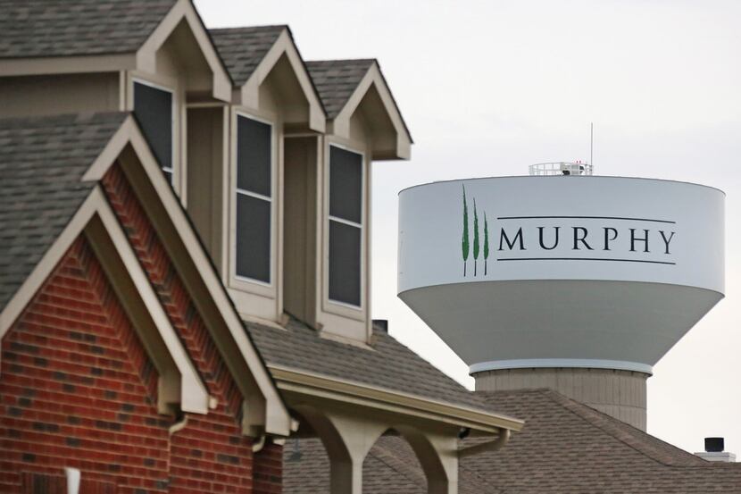 A water tower looms over an upscale neighborhood in Murphy on Tuesday.