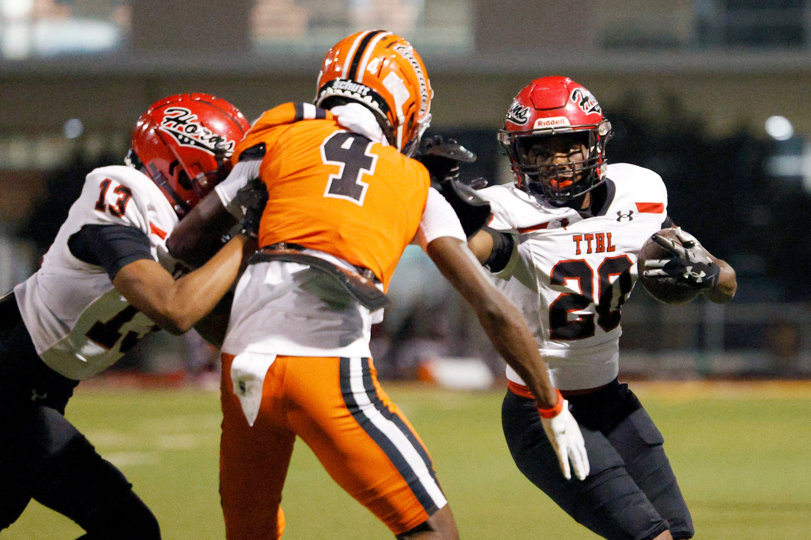 Cedar Hill running back CJ Castleberry (20) runs the ball as wide receiver Jaxon Caldwell...