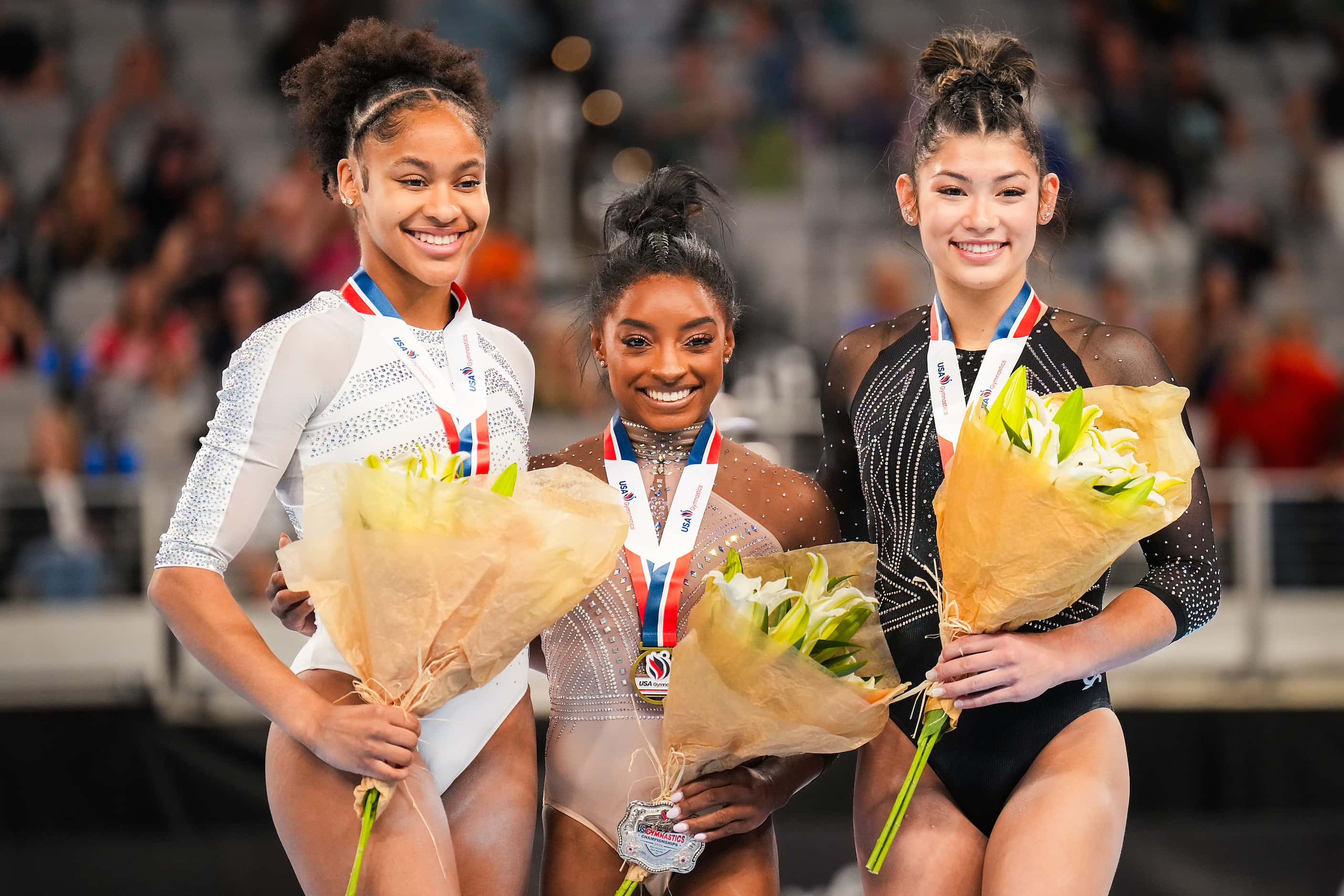 From left, silver medalist Skye Blakely, gold medalist Simone Biles and bronze medalist...