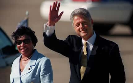 President Bill Clinton walks with congresswoman Eddie Bernice Johnson after he arrived at...