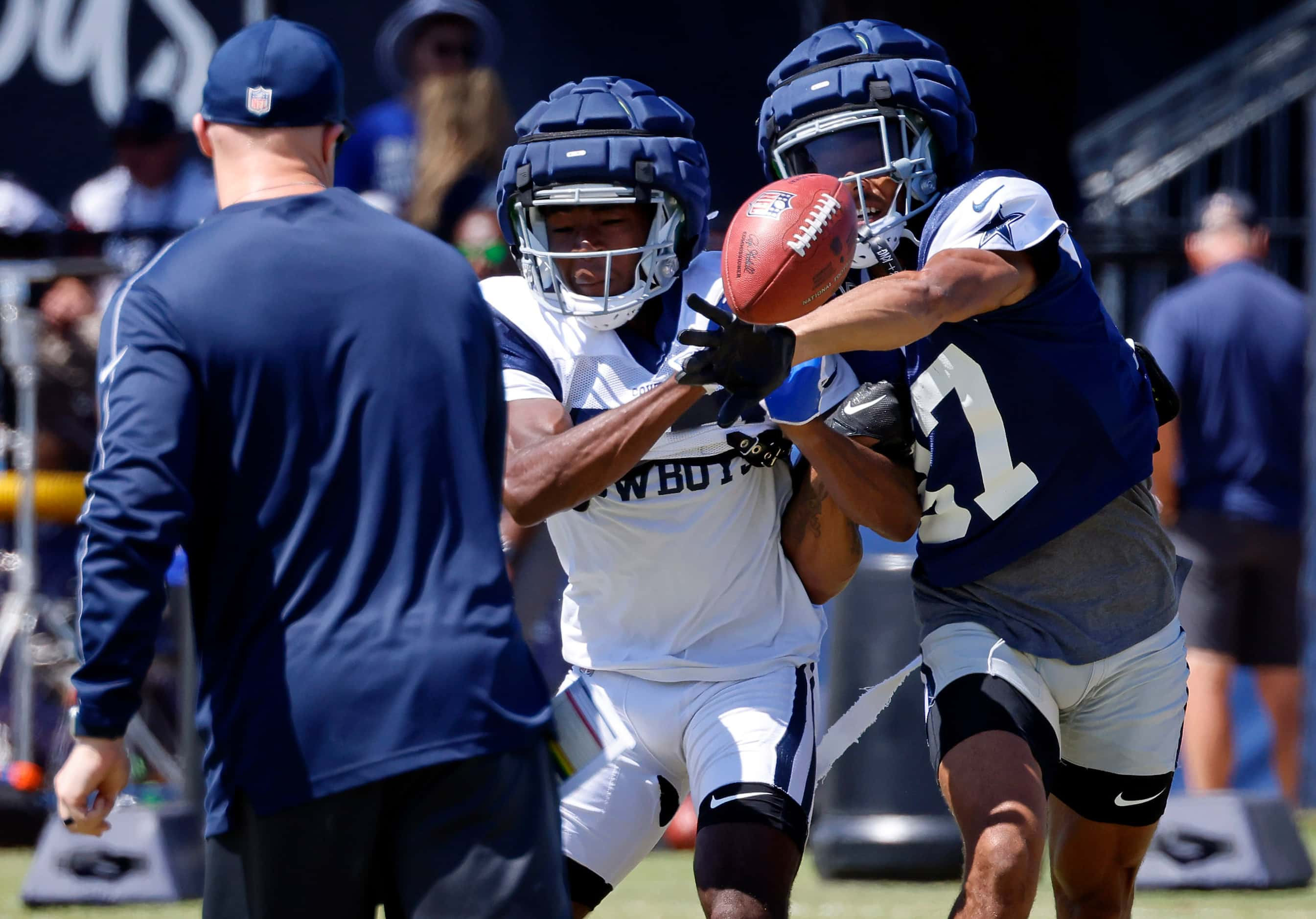 Dallas Cowboys cornerback Eric Scott Jr. (37) deflects a pass to a teammate during a...