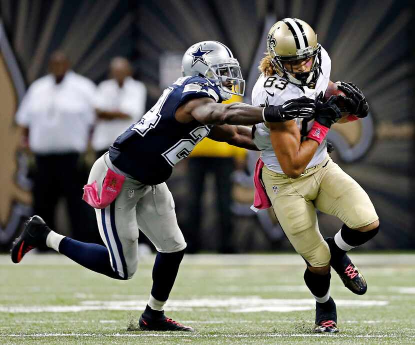 Dallas Cowboys cornerback Morris Claiborne (24) tries to stop New Orleans Saints wide...