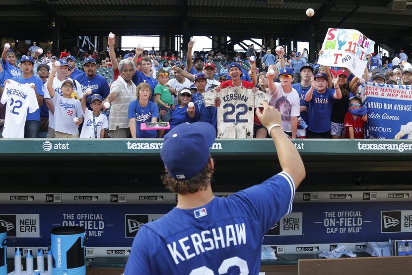 Los Angeles Dodgers pitcher Clayton Kershaw signs autographs before the Los Angeles Dodgers...