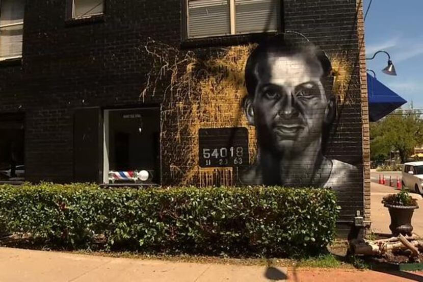 A mural of Lee Harvey Oswald is being painted at the Members Only barbershop in Oak Cliff.