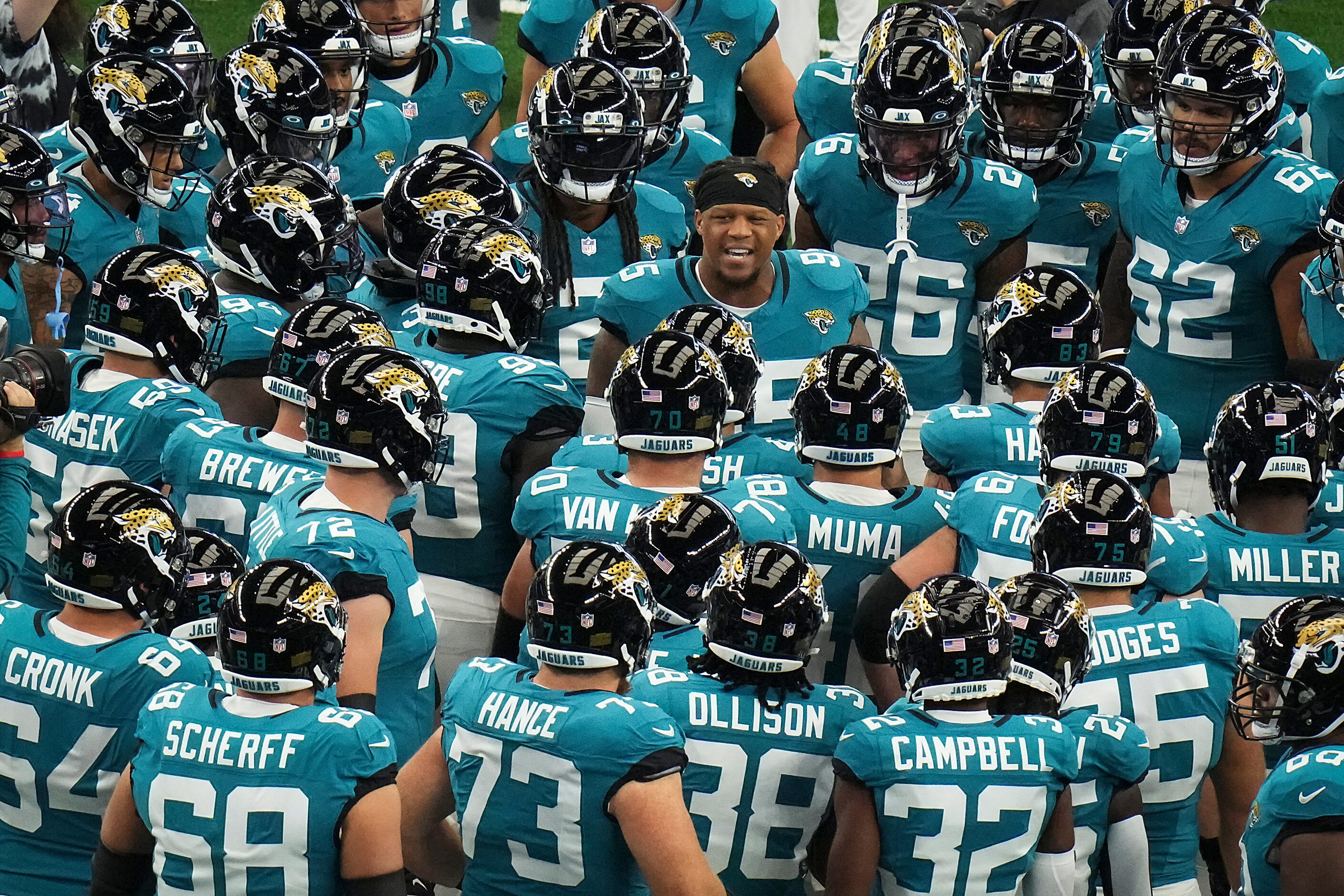 Jacksonville Jaguars player huddle around defensive end Roy Robertson-Harris (95) before an...