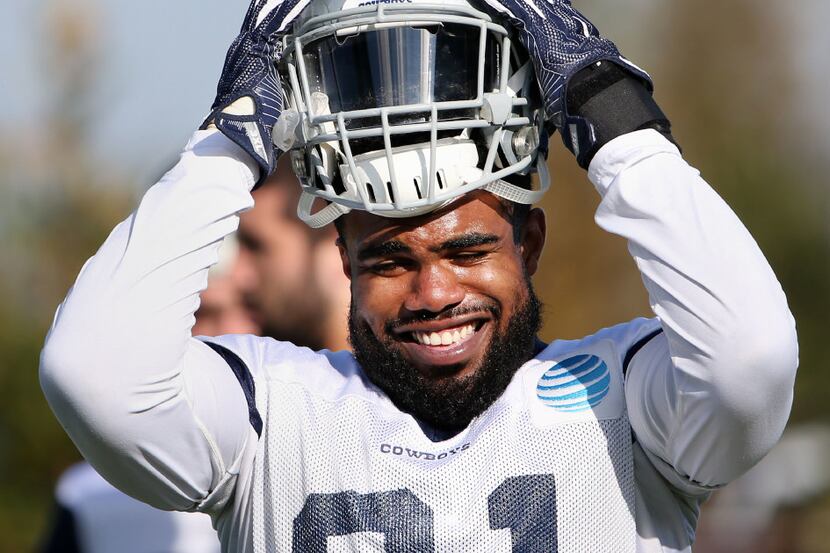 Dallas Cowboys running back Ezekiel Elliott (21) in between drills during team practice at...