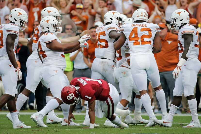 Oklahoma Sooners quarterback Kyler Murray (1) gets up slowly off the turf as the Texas...