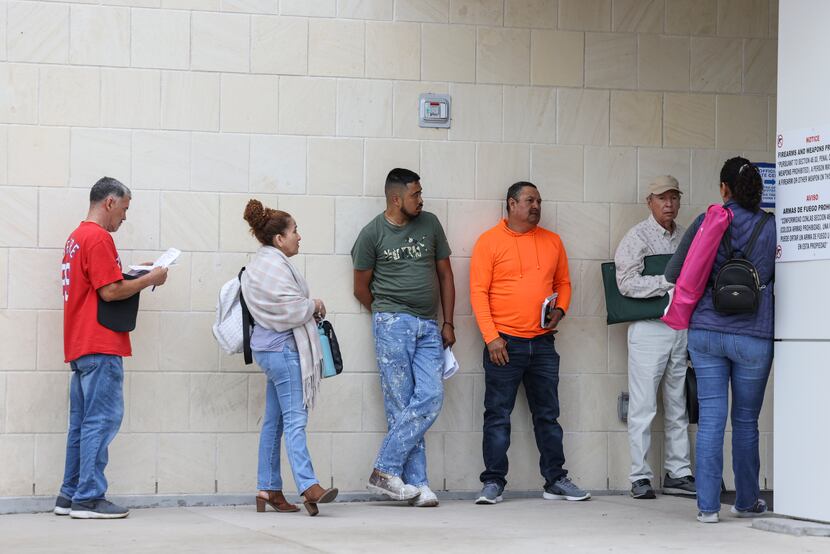 Dallas County residents wait in line to vote on Tuesday, May 24, 2022, at Oak Cliff...