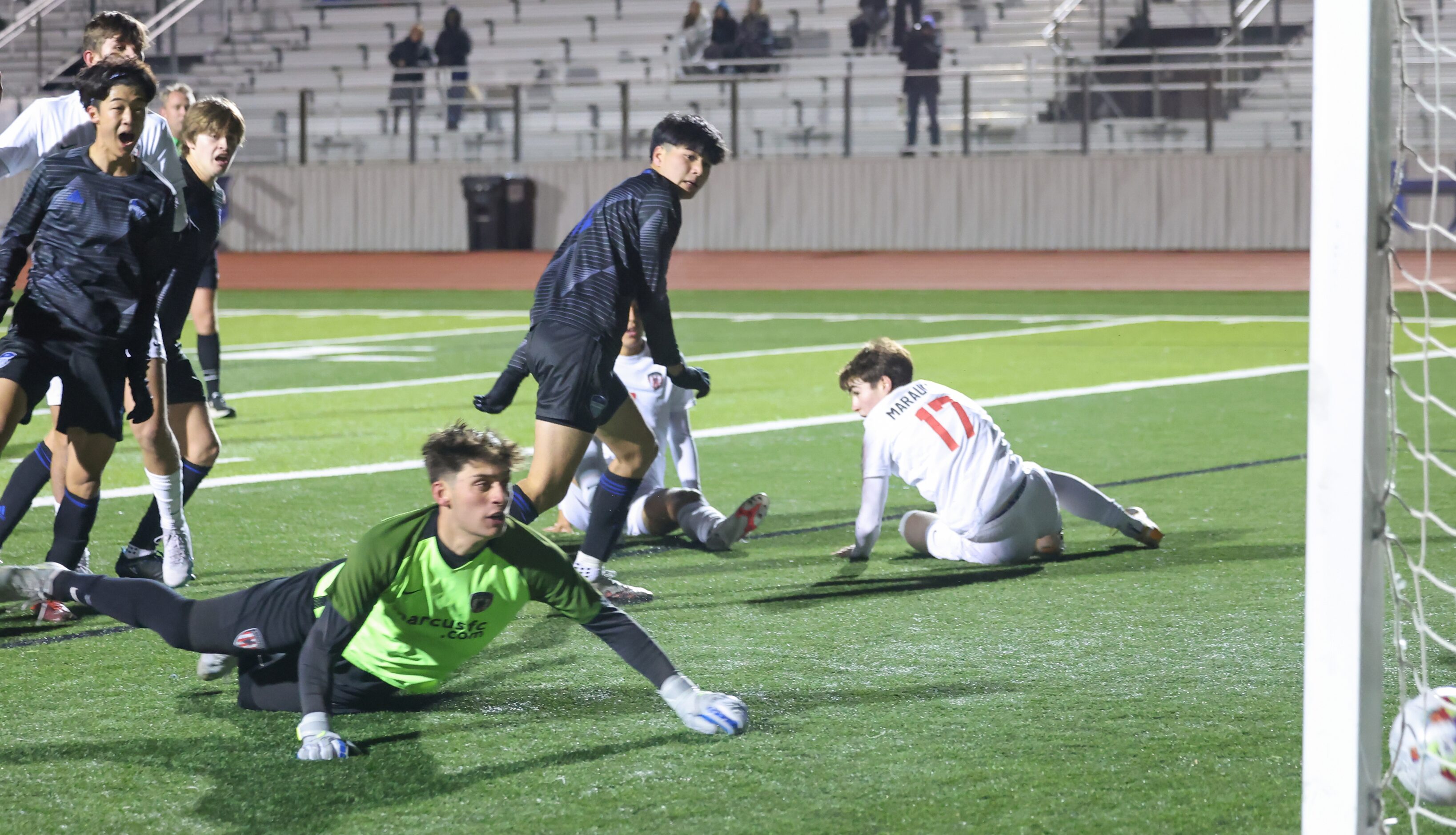 Hebron’s Jalen Zhou (14, left) shouts as the ball passes Flower Mound Marcus goalkeeper in...