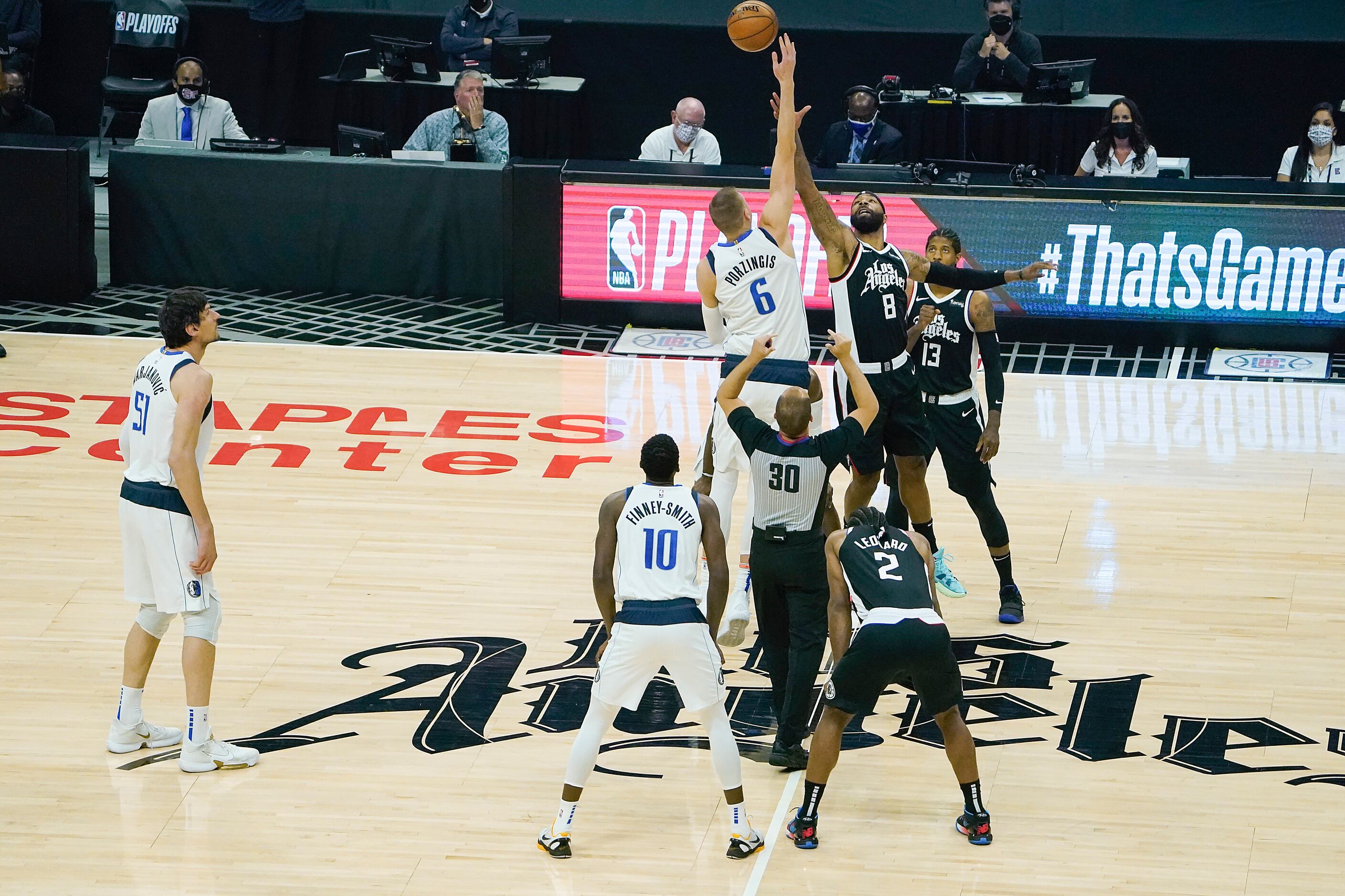 Dallas Mavericks center Kristaps Porzingis (6) wins the opening tipoff of an NBA playoff...