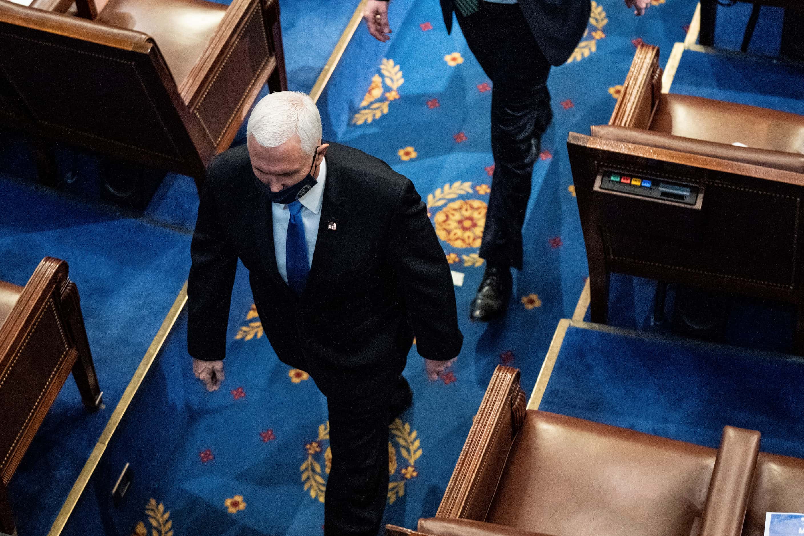 Vice President Mike Pence walks off the House floor as a joint session of the House and...