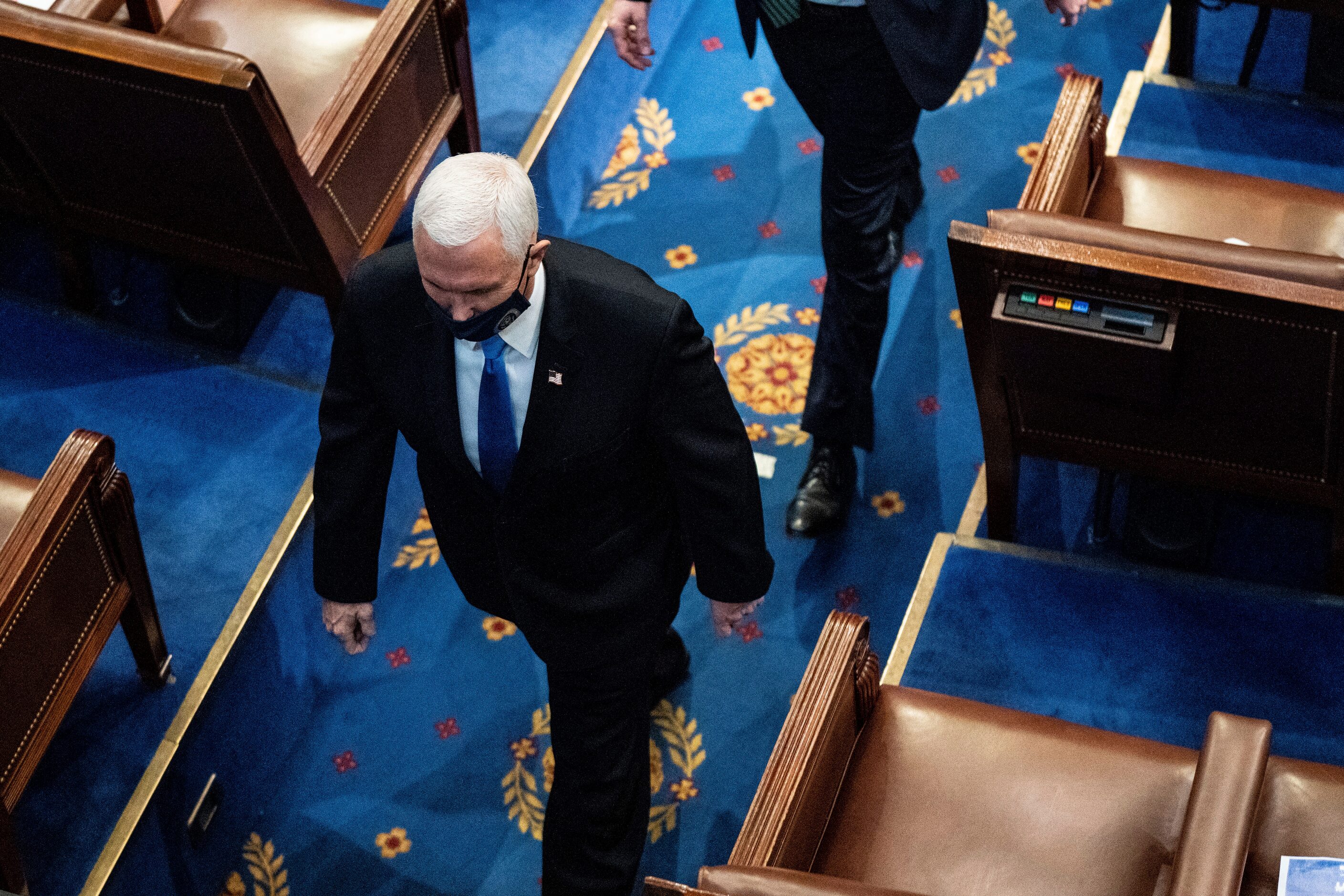 Vice President Mike Pence walks off the House floor as a joint session of the House and...