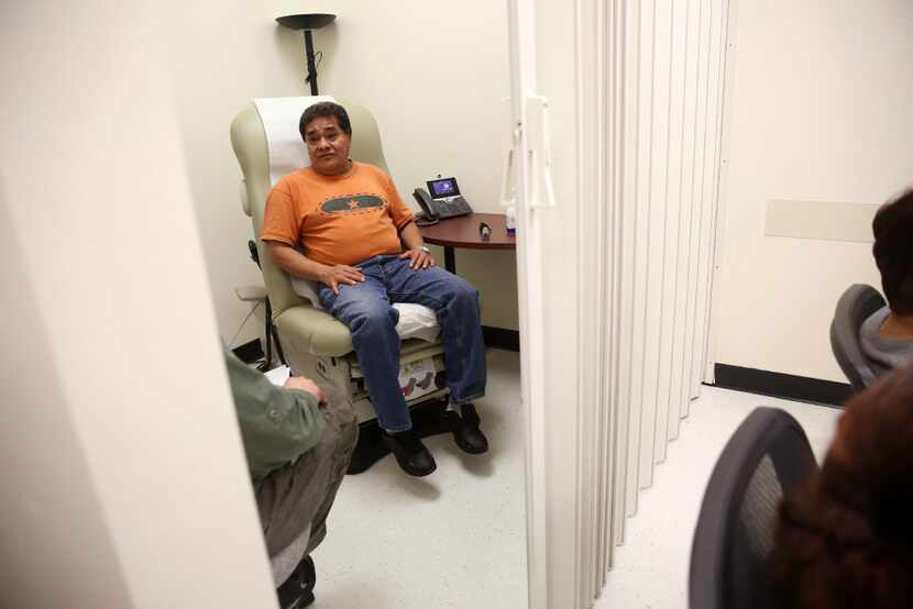 Juan Angon waits for his private exam during a shared medical appointment for patients with...