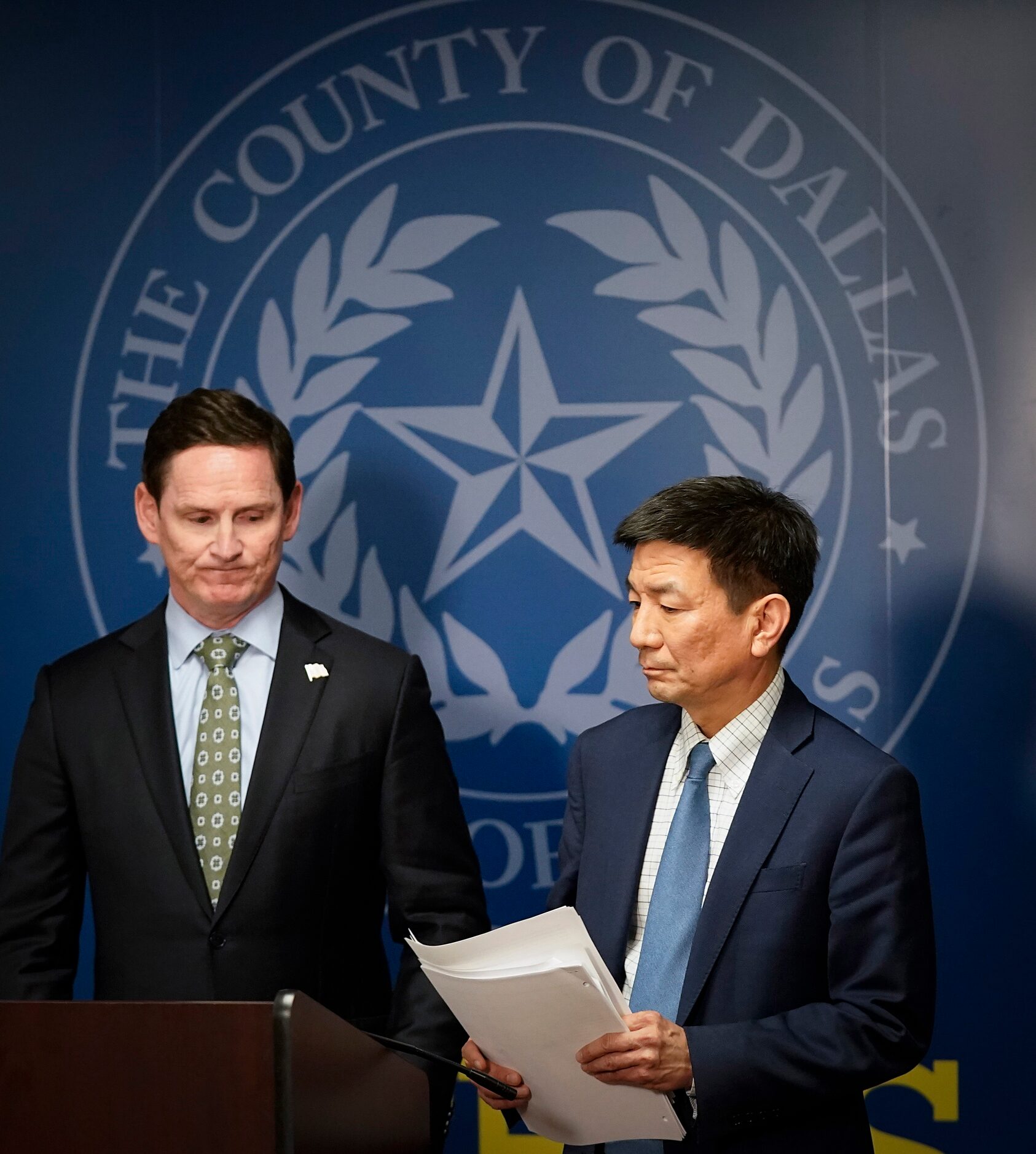 Dallas County Judge Clay Jenkins turns the podium over to Dr. Philip Huang, Director of...