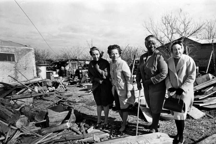 In January 1967, a team of Neighborhood Improvement Program workers examines a yard in South...