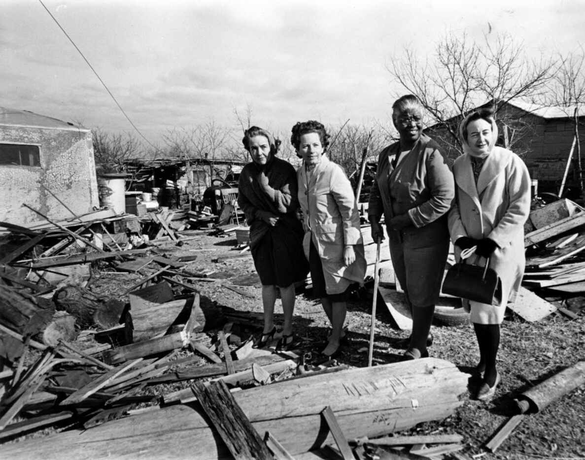 In January 1967, a team of Neighborhood Improvement Program workers examines a yard in South...