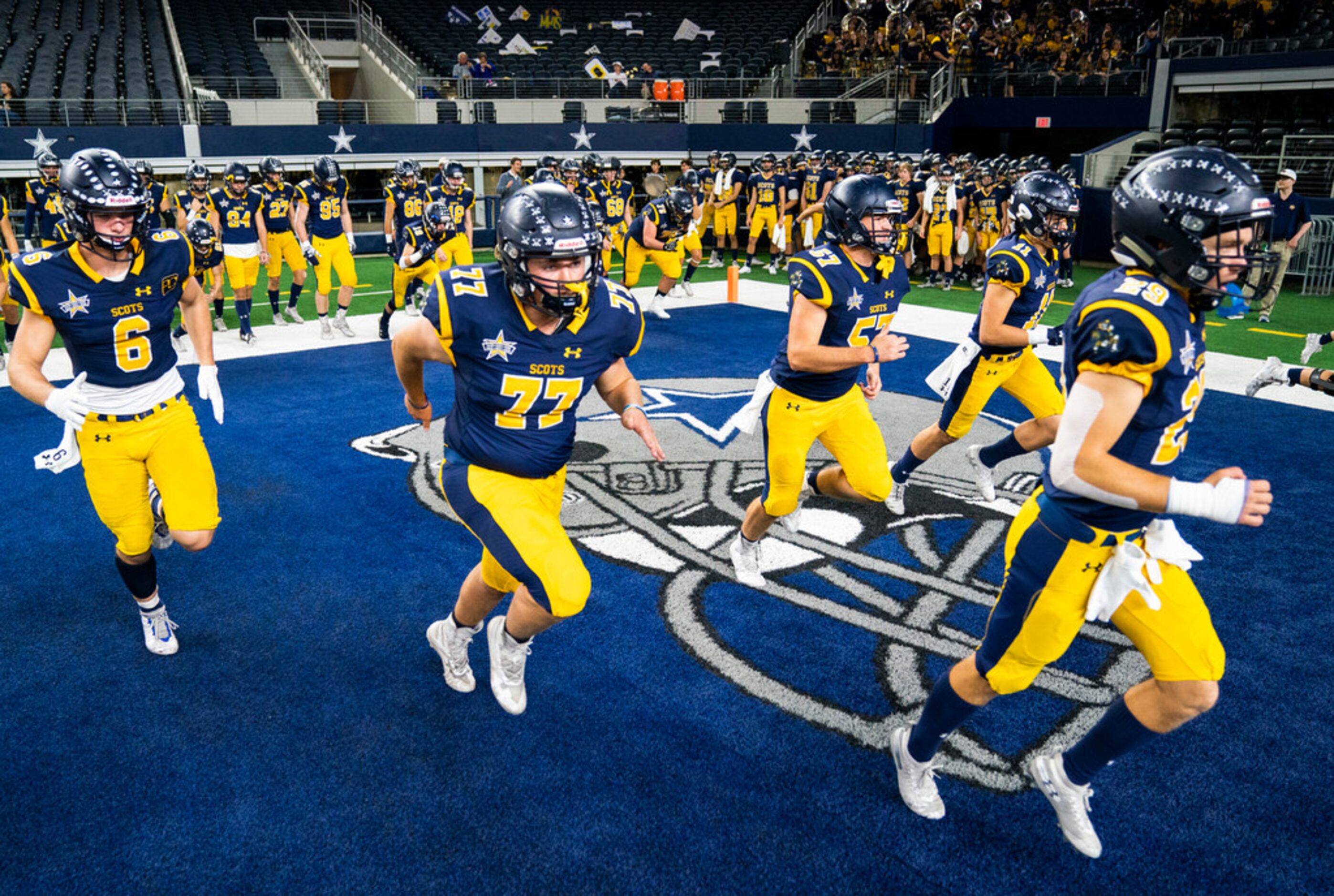 Highland Park football players warm up before a Class 5A Division I area-round playoff game...