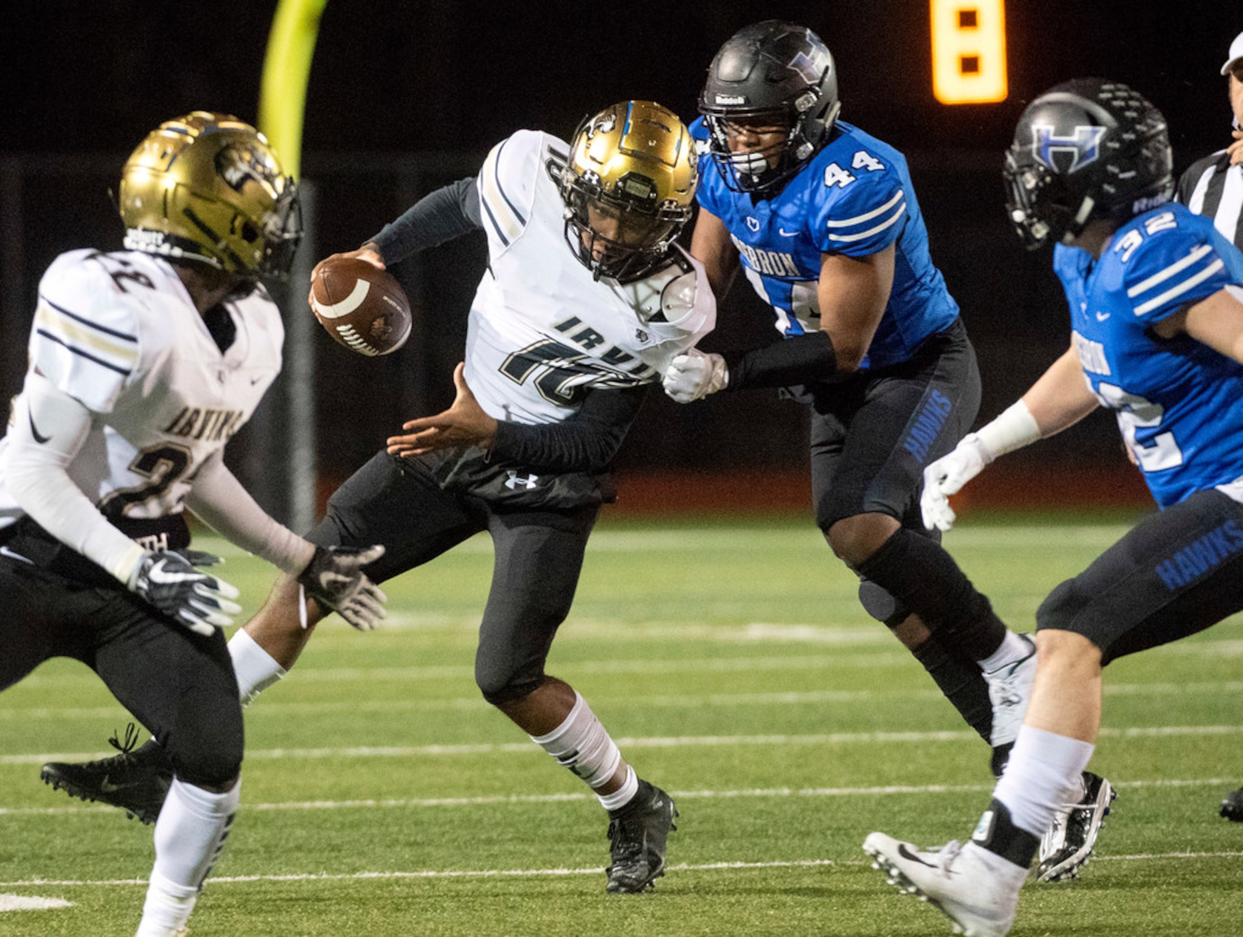 Hebron defensive end Jordan Haney (44) drags down Irving sophomore quarterback Curtis...