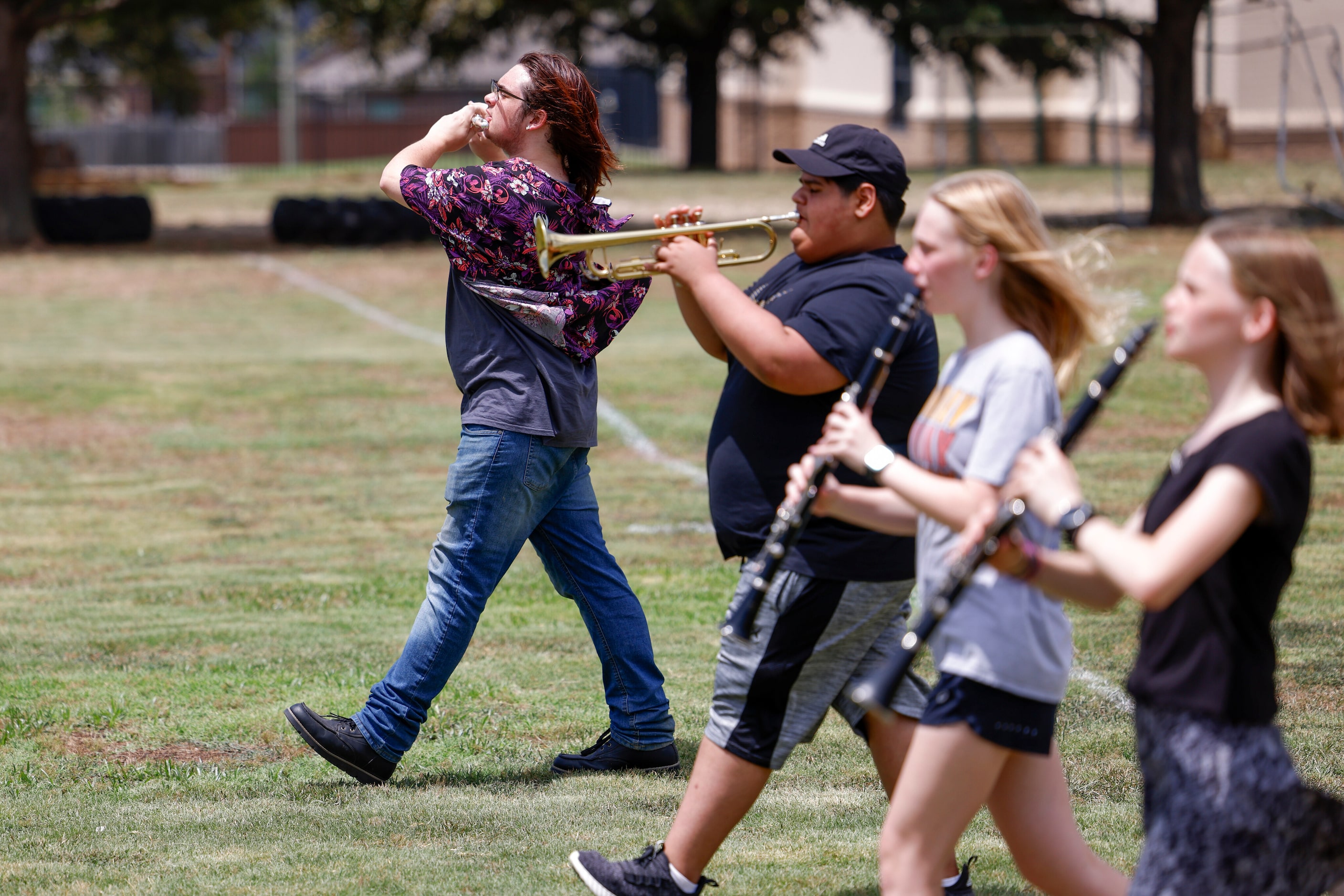 Jareth Vickery, 17 (left), plays the flute during a Valley View High School summer band...