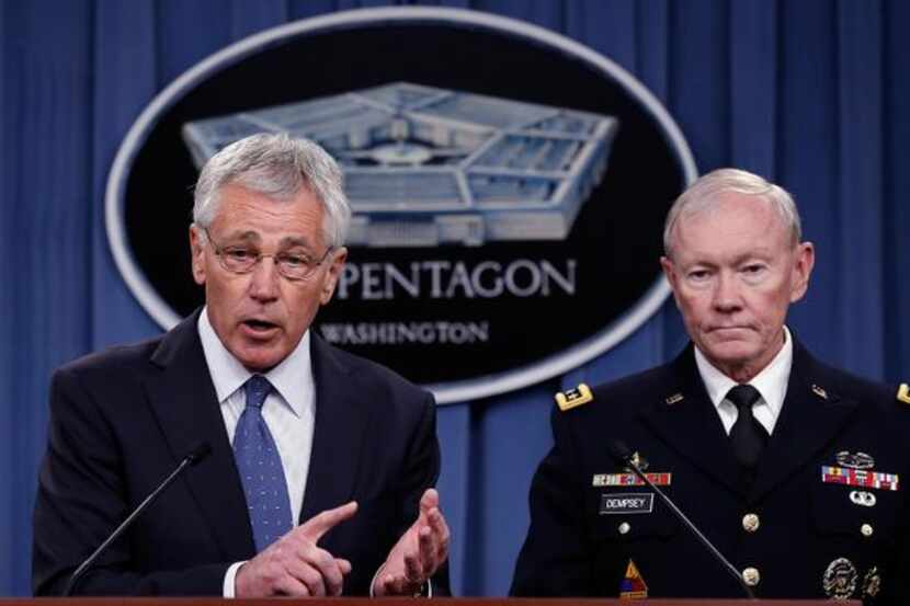 
U.S. Secretary of Defense Chuck Hagel (left) and Chairman of the Joint Chiefs of Staff Gen....