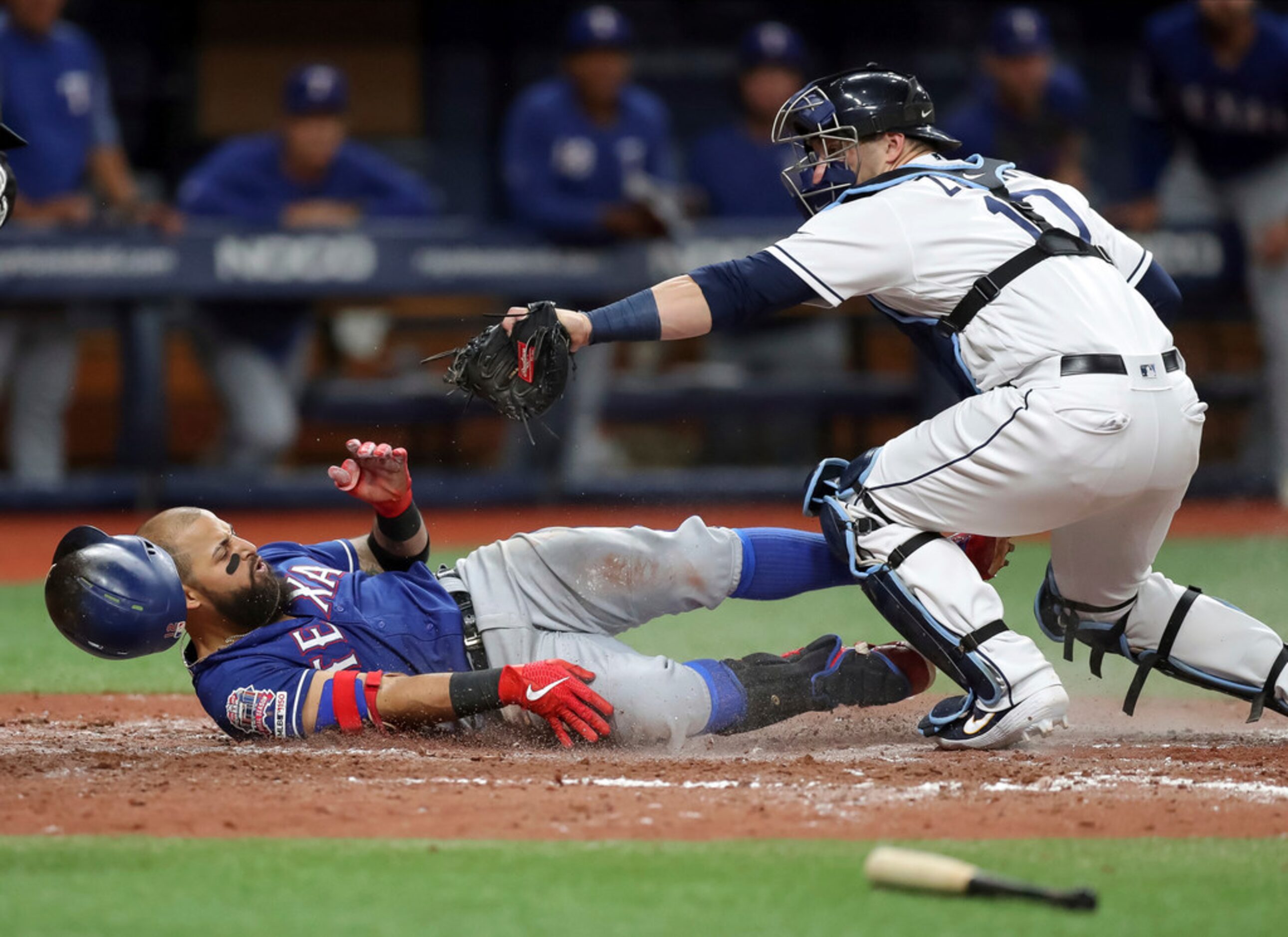 Tampa Bay Rays catcher Mike Zunino tags out Texas Rangers' Rougned Odor, who attempted to...