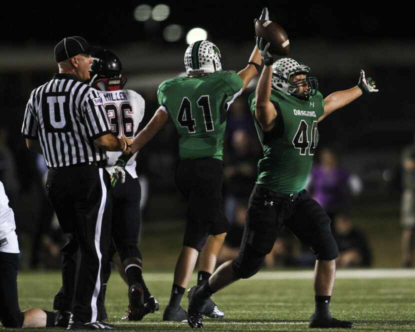 Southlake Carroll linebacker Steven Bergmark (40) celebrates a recovered fumble in the third...