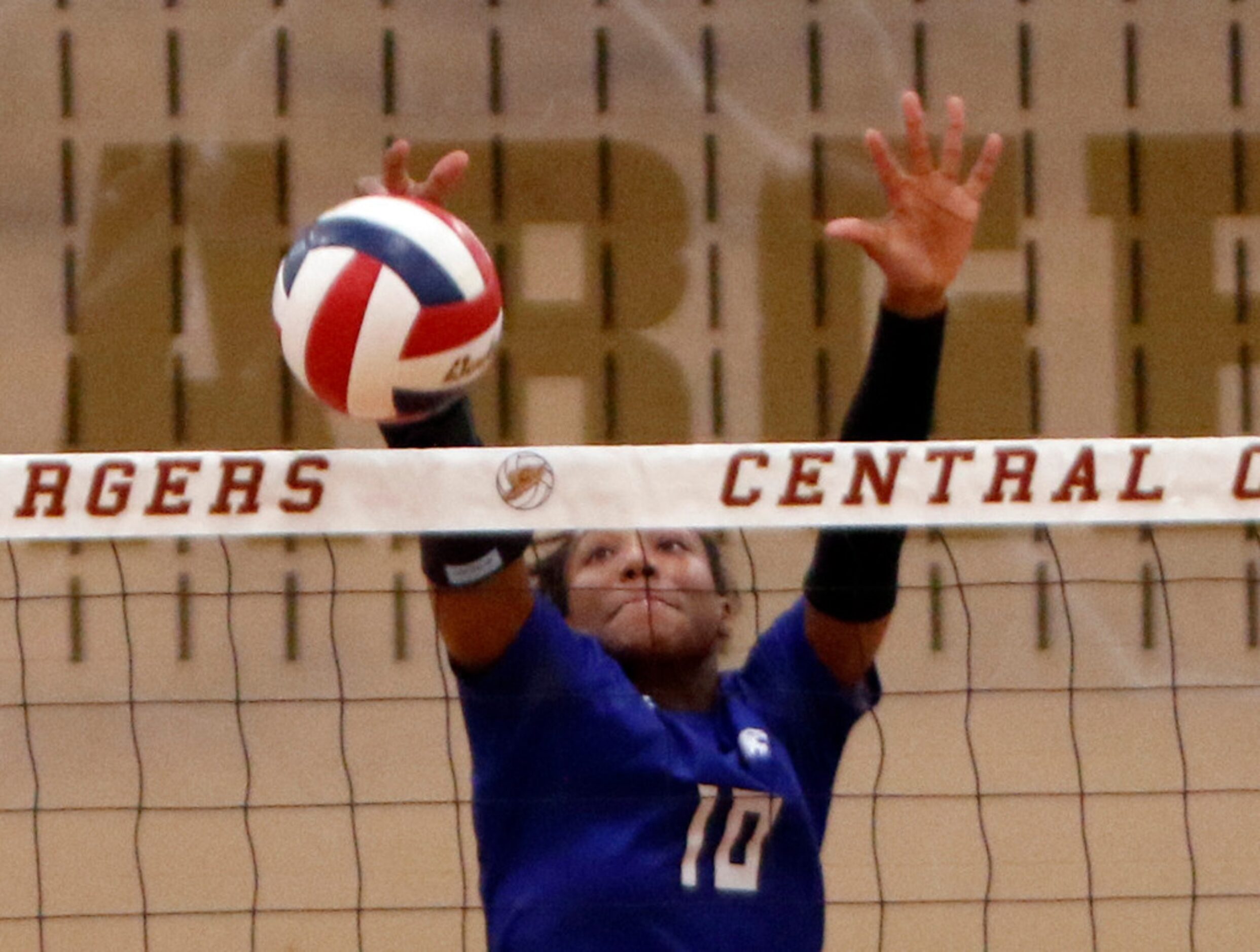 Trophy Club Byron Nelson outside hitter Caritie Luper (10) skies to deny a shot from a...