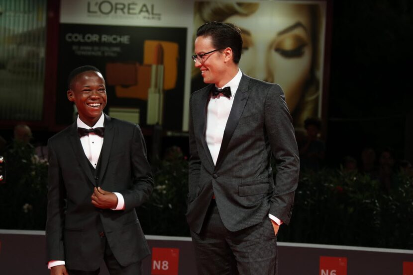 Abraham Attah and Cary Fukunaga pose for photographers on the red carpet before Beasts of No...