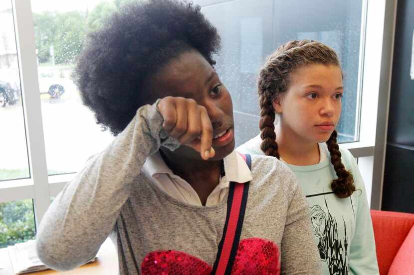 
Dade Middle School students Tri’ana Jackson (left) and Sciarrah  Bryson spoke at a meeting...