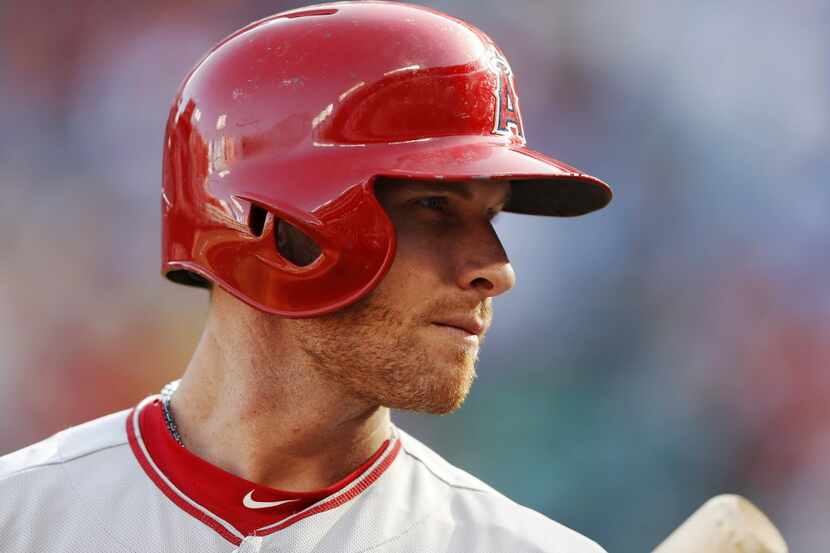 Los Angeles Angels left fielder Josh Hamilton (32) looks in the stands to see who is talking...