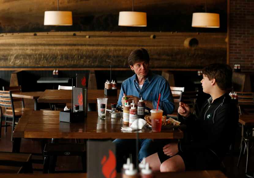 Roman Kikta and son Alex Kikta eat lunch together at Tri Tip Grill at The Star in Frisco,...