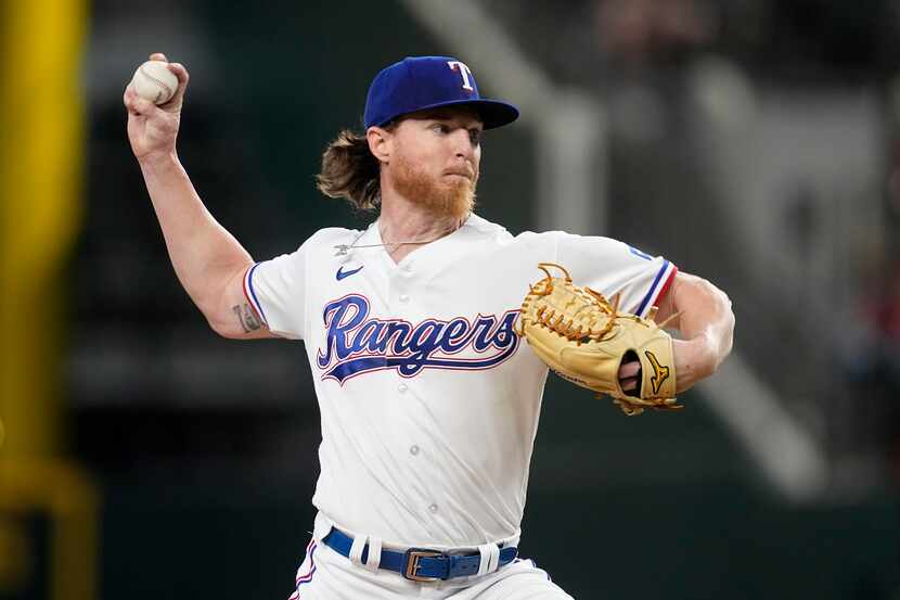 Texas Rangers starting pitcher Jon Gray throws to the Boston Red Sox in the first inning of...