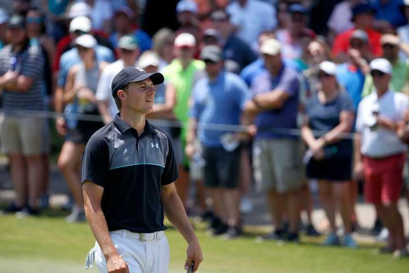 Jordan Spieth reacts after missing a birdie putt on the 16th green during the final round of...
